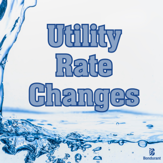 Flowing water with text "Utility Rate Changes" in bold, blue lettering