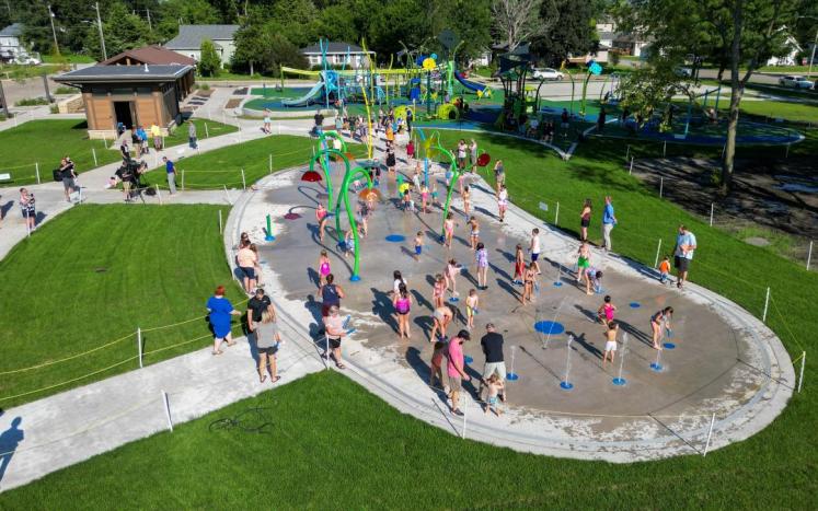 Kids playing at the splash pad in City Park