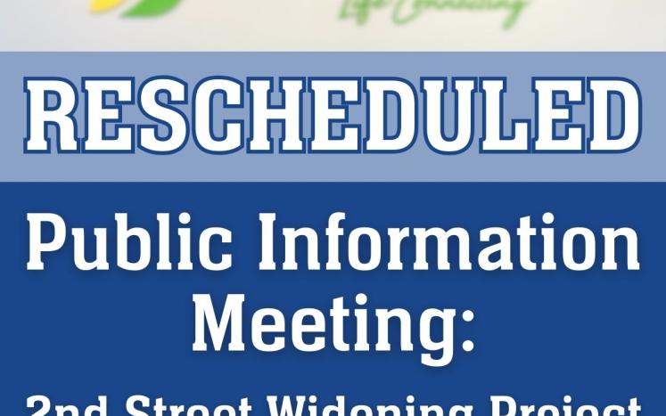 City council chambers with the text "RESCHEDULED. Public Information Meeting: 2nd Street Widening Project"